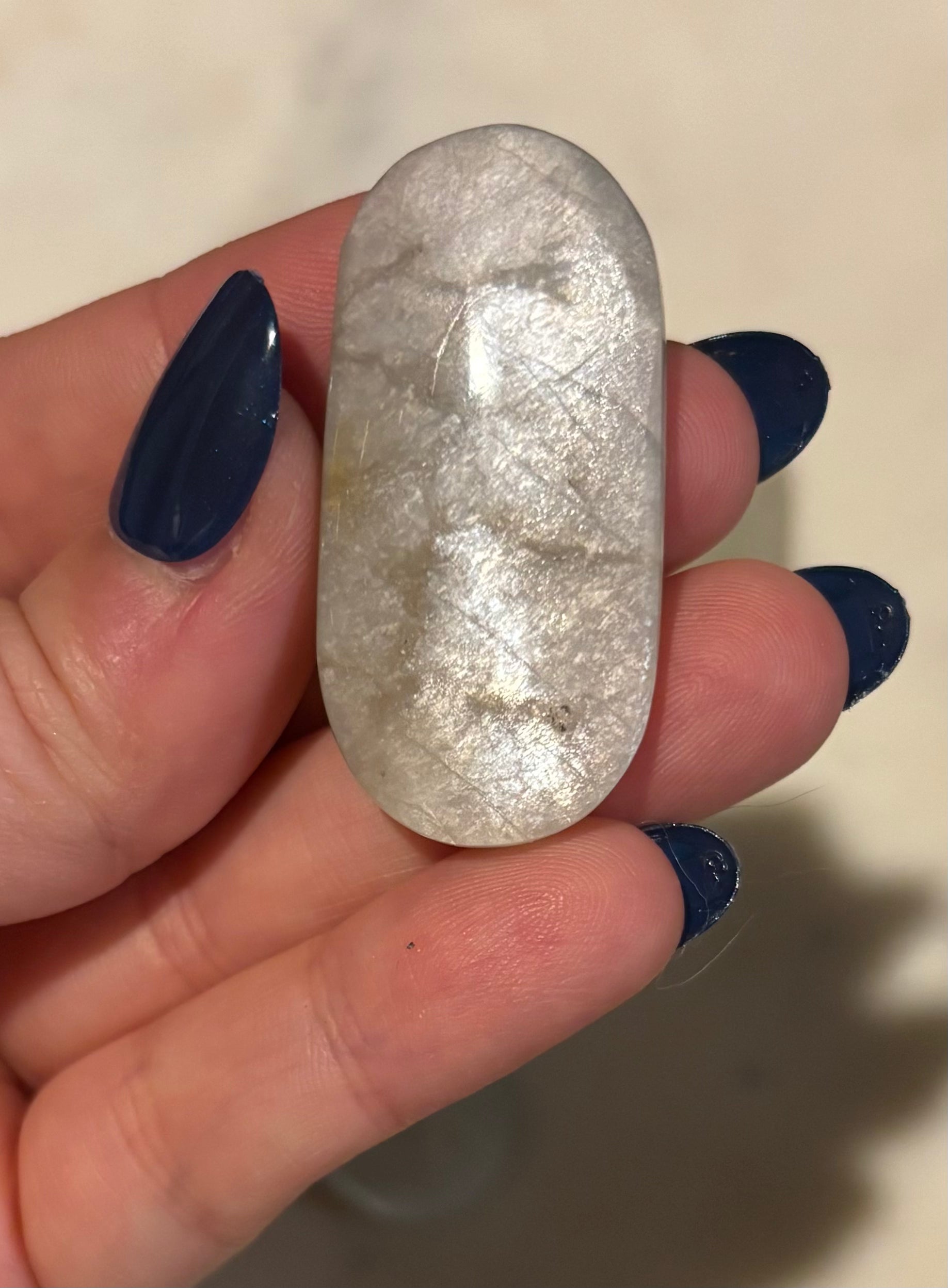 Green moonstone pocket stone