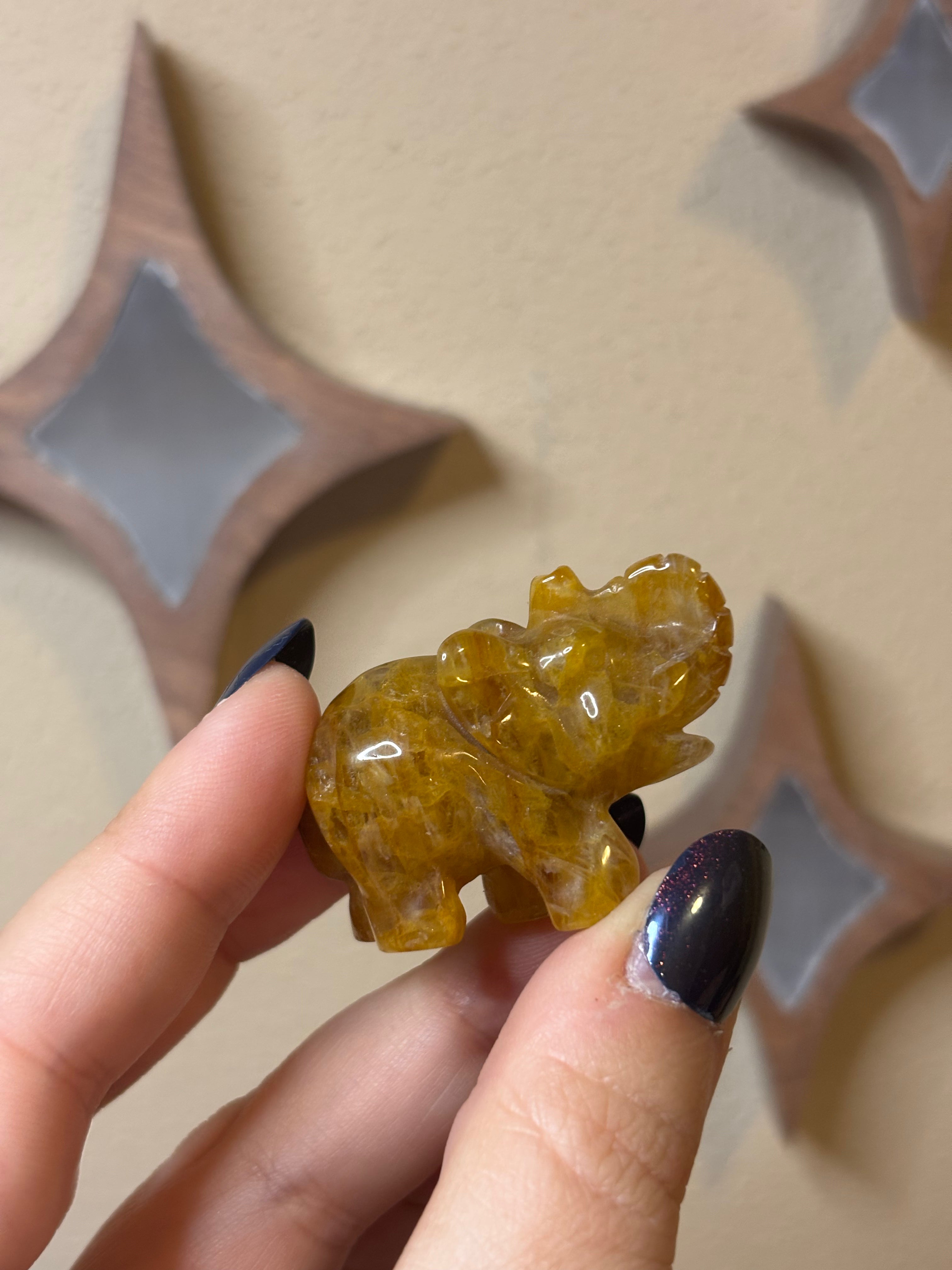 Golden healer elephant carving