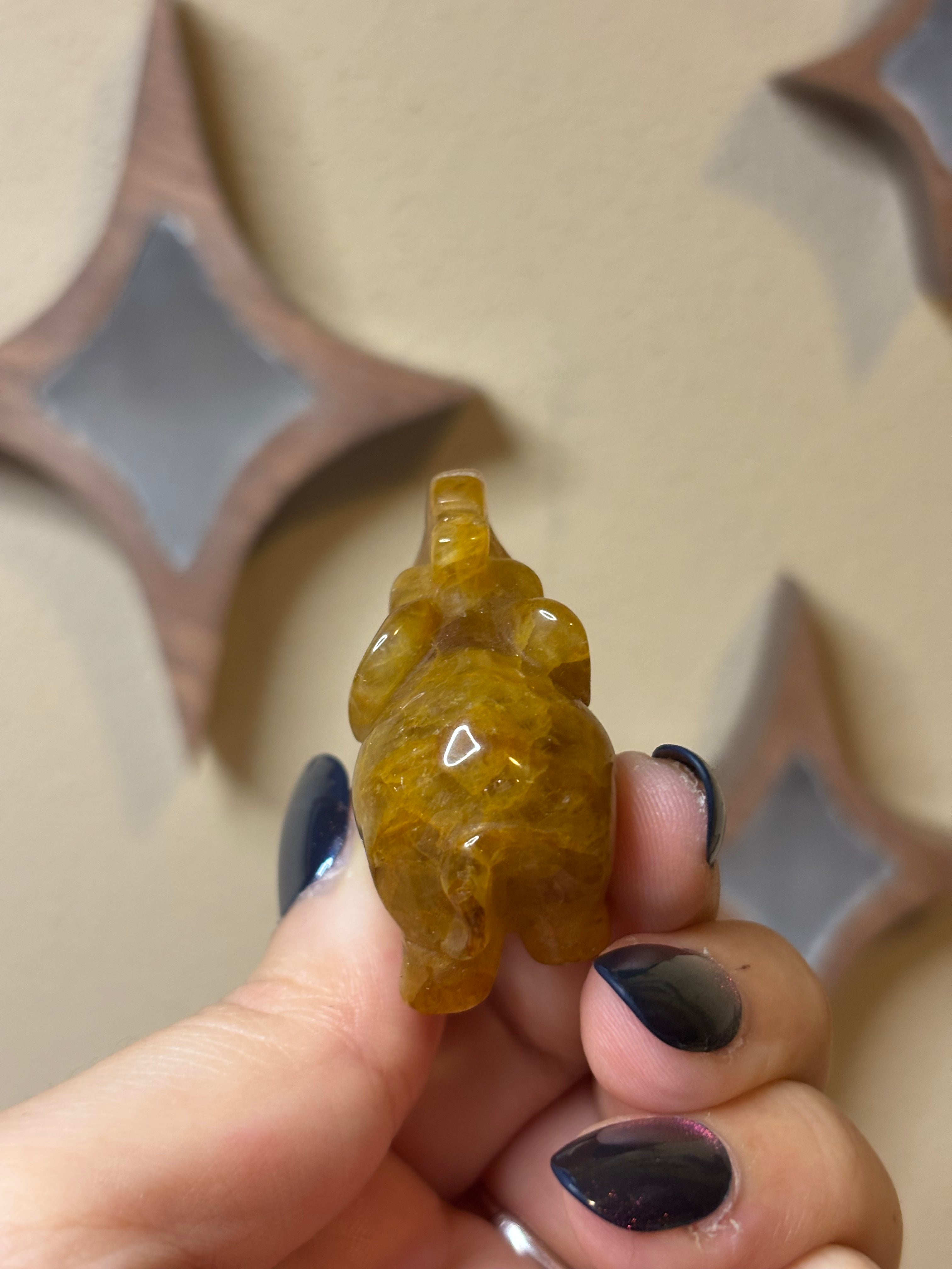 Golden healer elephant carving