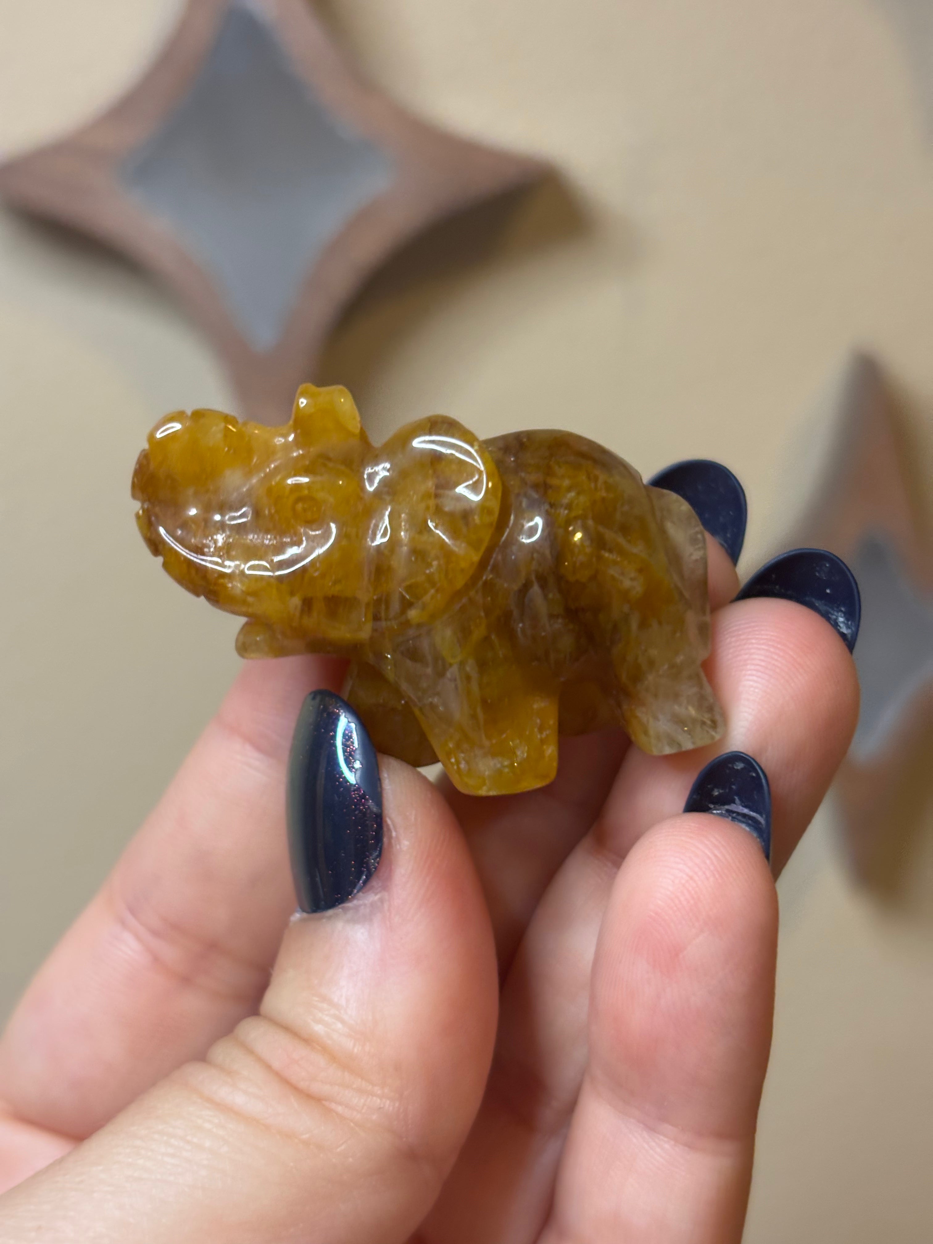 Golden healer elephant carving