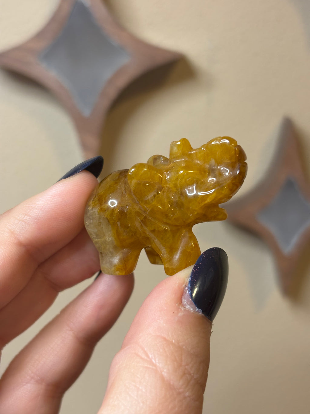 Golden healer elephant carving