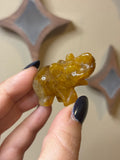 Golden healer elephant carving