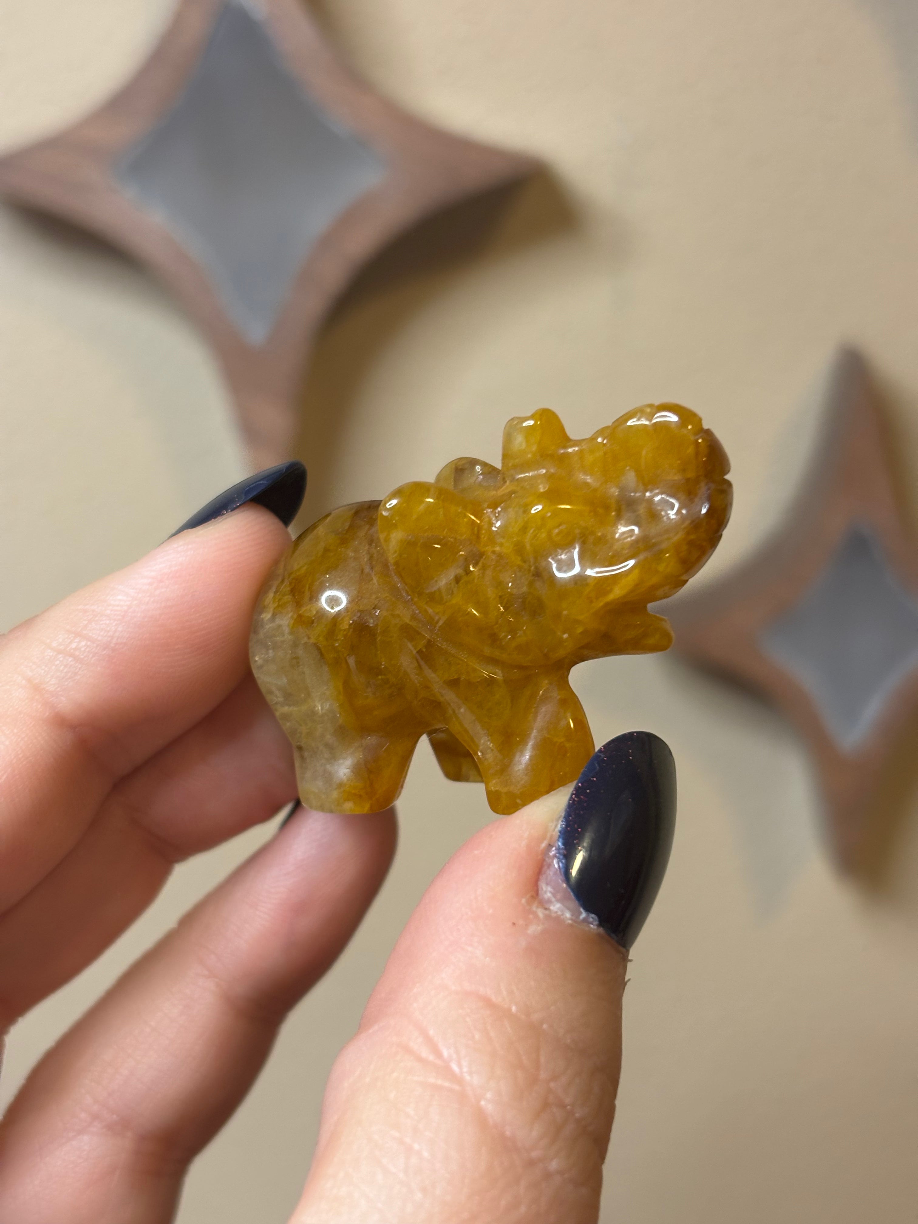 Golden healer elephant carving